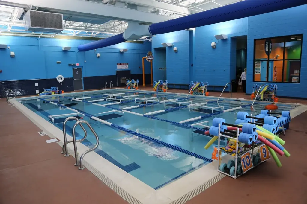 Indoor lap pool with lane tiles and flotation equipment